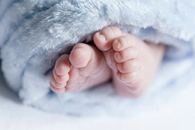 Close up of feet of a newborn baby model released Symbolfoto  STBF00372