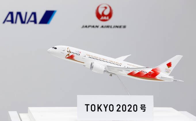 October 25, 2019, Tokyo, Japan - A model plane with a special design for the aircraft to deliver Olympic flame from Greece is displayed in Tokyo on Friday, October 25, 2019. Judo Olympic gold medalist Tadahiro Nomura and women s wrestling gold medalist Saori Yoshida will carry Olympic flame back to Japan next March for Tokyo 2020 Olympics torch relay.  (115129909)