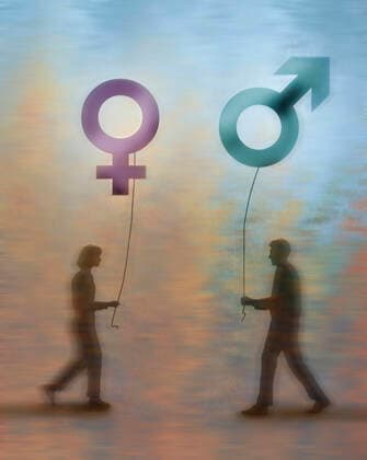 Mann und Frau nähern sich einander mit Gender-Luftballons *** Man and woman approach each other with gender balloons  Copyright: xGaryxWatersx 11591873