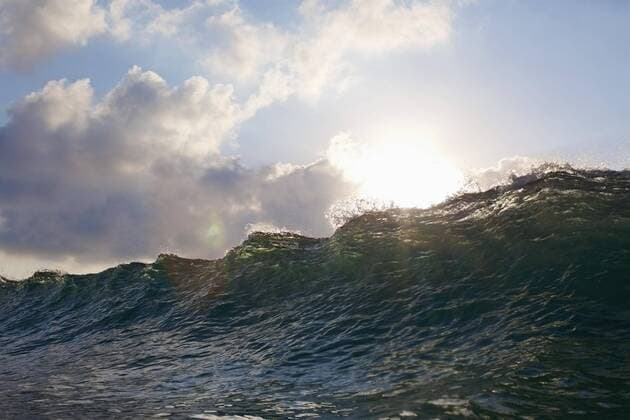 Sun shining over cresting ocean wave Mexico Nayarit Sayulita  Copyright: NikxWest fStopImages1849010