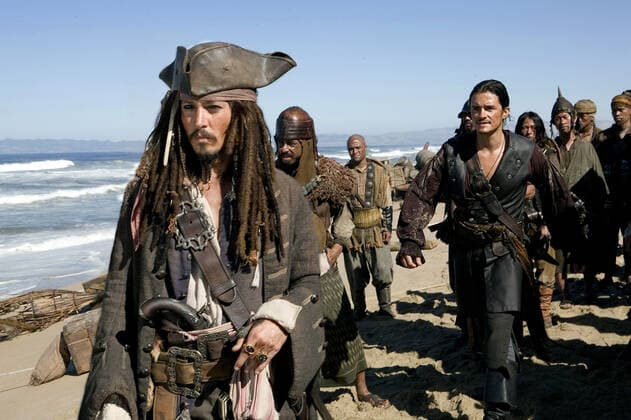 Johnny Depp & Orlando Bloom Characters: Jack Sparrow & Will Turner Film: Pirates Of The Caribbean: At World S End; Pirates Of The Caribbean 3 (USA 2007) Director: Gore Verbinski 19 May 2007 Pictured: A scene from PIRATES OF THE CARIBBEAN: AT WORLD S END, directed by Gore Verbinski and produced by Jerry Bruckheimer, from a screenplay written by Ted Elliott & Terry Rossio.  Copyright: MaryxEvansxAFxArchivexDisney 12659143 editorial use only