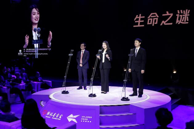 (191102) -- BEIJING, Nov. 2, 2019 -- Wang Yayu (L), awardee of Xplorer Prize in mathematics and physics field from Tsinghua University, Liu Ying (C), awardee of Xplorer Prize in life sciences field from Peking University and Li Tiefeng, awardee of Xplorer Prize in advanced interdisciplinary studies field from Zhejiang University, speak during the 2019 Xplorer Prize award ceremony in Beijing, capital of China, Nov. 2, 2019. The 2019 Xplorer Prizeawards ceremony kicked off here on Saturday. The Xplorer Prize was jointly initiated by Tencent Chairman and CEO Pony Ma and 14 scientists in 2018 to support full-time Chinese mainland-based scientists under age of 45 in areas of fundamental science and cutting-edge technologies. The 50 winners were from 26 organizations across China, including research institutions, universities and an enterpris