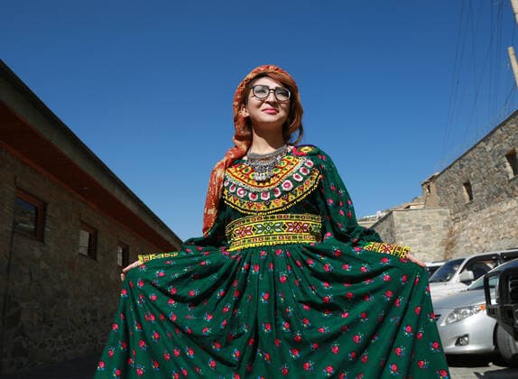 (191105) -- KABUL, Nov. 5, 2019 -- A model poses for photos after presenting costumes of ethnic people in Afghanistan during a fashion show in Kabul, capital of Afghanistan, Nov. 4, 2019. (Photo by Xinhua) AFGHANISTAN-KABUL-FASHION SHOW RahmatullahxAlizadah 