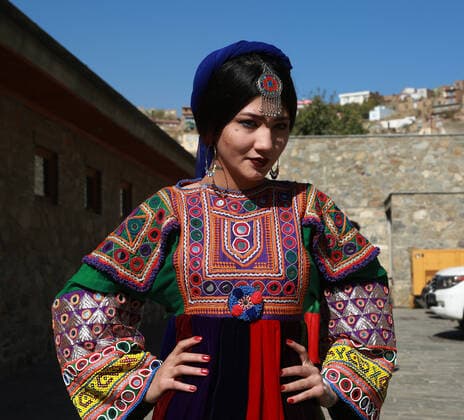 (191105) -- KABUL, Nov. 5, 2019 -- A model poses for photos after presenting costumes of ethnic people in Afghanistan during a fashion show in Kabul, capital of Afghanistan, Nov. 4, 2019. (Photo by Xinhua) AFGHANISTAN-KABUL-FASHION SHOW RahmatullahxAlizadah 