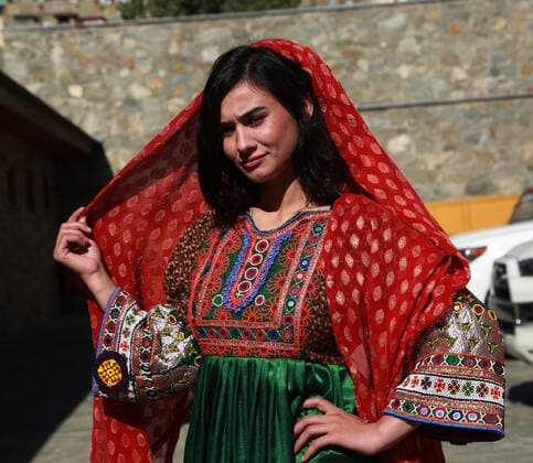 (191105) -- KABUL, Nov. 5, 2019 -- A model poses for photos after presenting costumes of ethnic people in Afghanistan during a fashion show in Kabul, capital of Afghanistan, Nov. 4, 2019. (Photo by Xinhua) AFGHANISTAN-KABUL-FASHION SHOW RahmatullahxAlizadah 