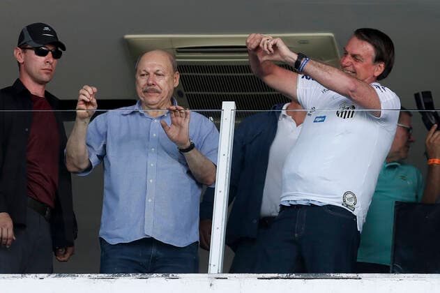 SANTOS, SP - 16.11.2019: SANTOS X SÃO PAULO FC - The President of the Republic, Jair Bolsonaro, and the President of Santos, Jose Carlos Peres, during the match between Santos and São Paulo FC, valid for the 33rd round of the 2019 Brazilian Championship. The match is held at Vila Belmiro Stadium, located in Santos. , SP. x1832376x  MarcoxGalvão