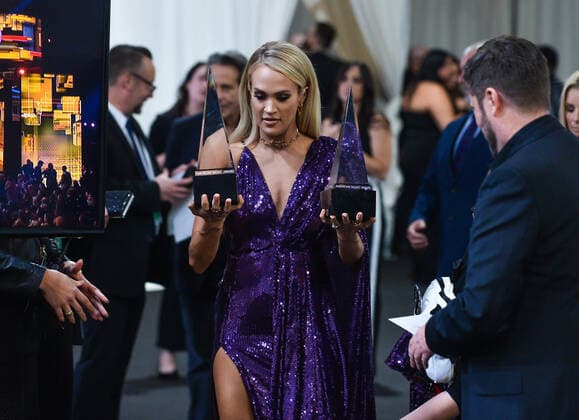 Singer Carrie Underwood appears backstage with her awards for Favorite Album - Country and the Favorite Female Artist - Country, during the 47th annual American Music Awards at the Microsoft Theater in Los Angeles on Sunday, November 24, 2019.  LAP20191124315 JIMxRUYMEN