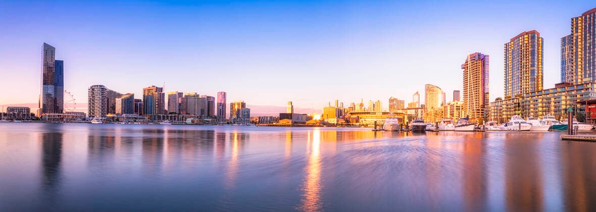 Modern buildings in front of Yarra River at Melbourne Docklands against sky at sunset, Victoria, Australia  SMAF01415