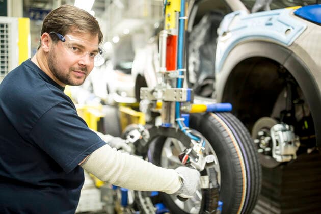 Portrait of confident worker in modern car factory model released Symbolfoto property released WESTF24381
