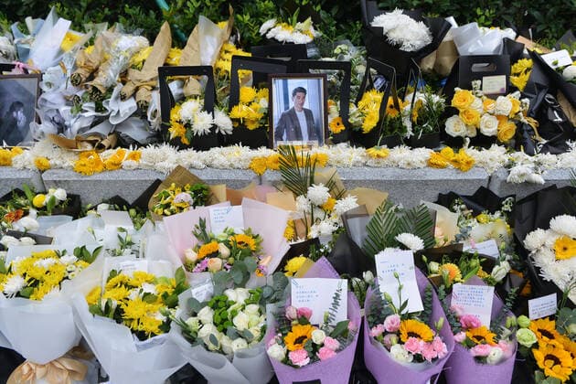 Fans lay individual wreathes and flowers at the recording scene in memorial of Godfrey Gao, a Taiwanese-Canadian model and actor, who died during the shooting of Zhejiang Television s reality show Chase Me, in Ningbo city, east China s Zhejiang province, 29 November 2019.