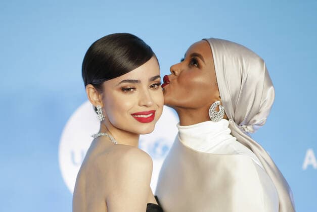 Sofia Carson and Halima Aden arrive on the red carpet at the 15th Annual UNICEF Snowflake Ball at Cipriani Wall Street on Tuesday, December 03, 2019 in New York City.  NYP20191203166 JOHNxANGELILLO