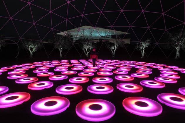December 4, 2019, Athens, Greece: Kid plays with light Installations at Stavros Niarchos Park. Stavros Niarchos Foundation Cultural Center decorated for Christmas. Athens Greece - ZUMAv62_ 20191204_zaf_v62_011 Copyright: xAristidisxVafeiadakisx