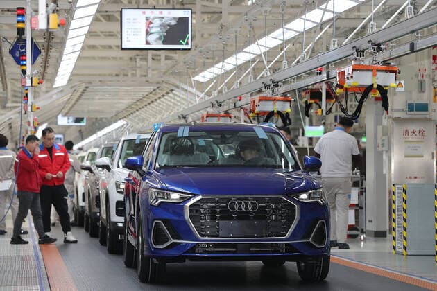 TIANJIN, CHINA - DECEMBER 05: Employees work on the assembly line of Audi Q3 at a whole-vehicle manufacturing base of the Sino-German joint venture FAW-Volkswagen Automotive Co Ltd on December 5, 2019 in Tianjin, China. Volkswagen Group China and its partners will invest over 4 billion euros in China in 2020.  Copyright: xVCGx CFP111262382192