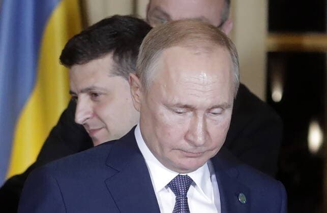PARIS, FRANCE â€“ DECEMBER 9, 2019: Russia s President Vladimir Putin (front), and Ukraine s President Volodymyr Zelenskyy (Vladimir Zelensky) attend a Normandy Four summit in the Murat Lounge in the Elysee Palace; talks in the so-called Normandy Four format involve representatives of Ukraine, Germany, France and Russia who discuss settlement of the conflict in eastern Ukraine. Mikhail Metzel TASS  TS0C6B2F