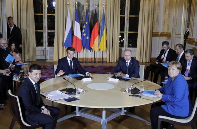 PARIS, FRANCE â€“ DECEMBER 9, 2019: Ukraine s President Volodymyr Zelenskyy (Vladimir Zelensky), France s President Emmanuel Macron, Russia s President Vladimir Putin, and Germany s Chancellor Angela Merkel (L-R seated) attend a Normandy Four summit in the Murat Lounge in the Elysee Palace; talks in the so-called Normandy Four format involve representatives of Ukraine, Germany, France and Russia who discuss settlement of the conflict in eastern Ukraine. Mikhail Metzel TASS  TS0C6B3C