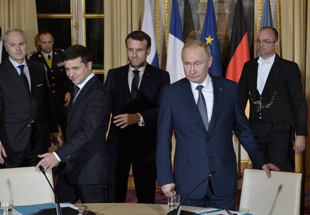 PARIS, FRANCE â€“ DECEMBER 9, 2019: Ukraine s President Volodymyr Zelenskyy (Vladimir Zelensky), France s President Emmanuel Macron, and Russia s President Vladimir Putin (L-R front) attend a Normandy Four summit in the Murat Lounge in the Elysee Palace; talks in the so-called Normandy Four format involve representatives of Ukraine, Germany, France and Russia who discuss settlement of the conflict in eastern Ukraine. Alexei Nikolsky Russian Presidential Press and Information Office TASS  TS0C6B78