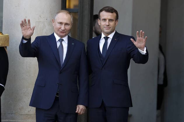 (191210) -- PARIS, Dec. 10, 2019 -- French President Emmanuel Macron welcomes Russian President Vladimir Putin as he arrives at the Elysee Presidential Palace to attend a summit on Ukraine in Paris, France, Dec. 9, 2019. Ukraine and Russia agreed on a full and comprehensive implementation of the ceasefire in eastern Ukraine before the end of 2019, leaders of Russia, Ukraine, France and Germany announced in Paris on Monday evening following their talks called Normandy four summit . (Photo by Jack Chan Xinhua) FRANCE-PARIS-NORMANDY FOUR SUMMIT GaoxJing 