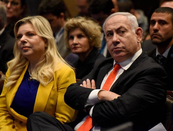 Israeli Prime Minister Benjamin Netanyahu and his wife, Sara, attend a ceremony for the opening of the Brazil Trade Mission in Jerusalem, on Sunday, December 15, 2019. Eduardo Bolsonaro, son of Brazilian president, said Brazil will move their embassy to Jerusalem. The opening is part of Netanyahu s efforts to have countries recognize Jerusalem as Israel s capitol and move embassies and offices there.  JER2019121518 DEBBIExHILL