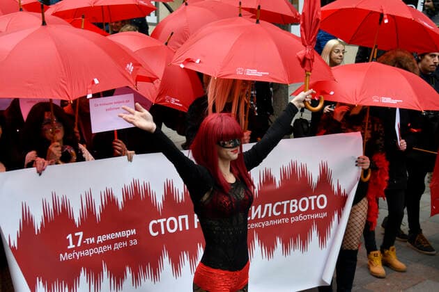 Prostitute protest - Skopje, Macedonia 17.12.2019., Skopje, Macedonia - Annual Mars of the Red Umbrellas held to promote the rights of sex workers in Macedonia. Girls with masks and red umbrellas marched and demand from state bodies to remove prejudice and condemnation and prevent violence against sex workers.  STR-1234 HaloPix PIXSELL