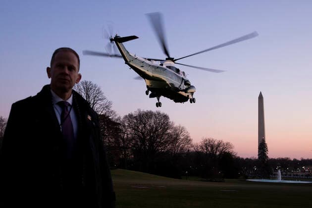 A US Secret Service agent stands by as Marine One departs carrying US President Donald J. Trump en route to a rally in Michigan; on the South Lawn of the White House, in Washington, DC, USA, 18 December 2019. The US House of Representatives is poised to vote on two articles of impeachment against US President Donald J. Trump, for abuse of power and obstruction of Congress. If passed, Trump would become the third US president in history to be impeached. An impeachment would lead to a trial in the US Senate, where a two-thirds vote of approval would be necessary in order to remove Trump as president. Copyright: xStefanixReynoldsx