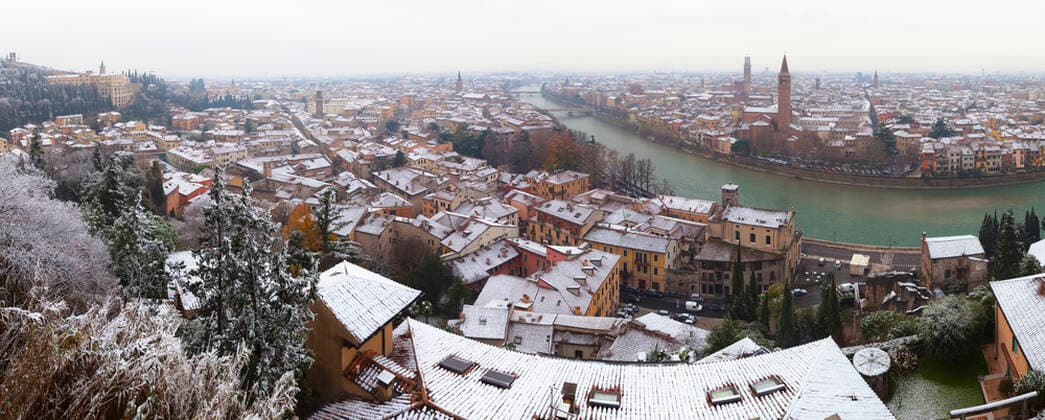 Italy, Verona, Panorama of riverside city in winter  GIOF07668