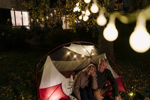 Senior couple camping in garden of their home at night model released Symbolfoto property released  GUSF03096