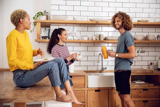 Friends having breakfast in the kitchen at home model released Symbolfoto property released  MCF00379