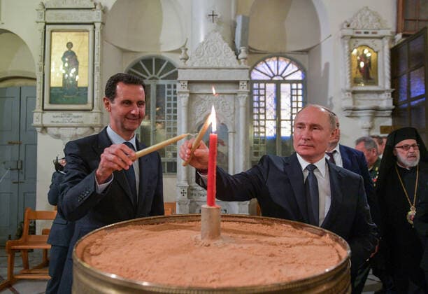 Bilder des Jahres 2020, News 01 Januar News Bilder des Tages DAMASCUS, SYRIA - JANUARY 7, 2020: Syria s President Bashar al-Assad (L) and Russia s President Vladimir Putin light candles in the Cathedral of Our Lady of the Dormition. Alexei Druzhinin Russian Presidential Press and Information Office TASS  TS0C9A4C