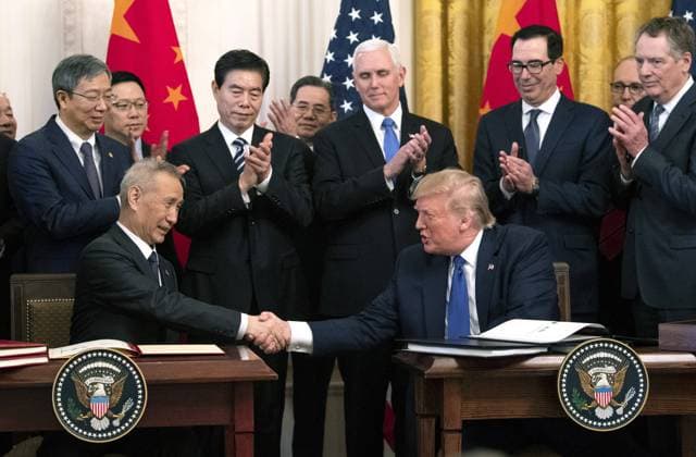 President Donald Trump (R) shakes hands with Chinese Vice Premier Liu He after they signed Phase 1 trade deal between the United States and China, during a ceremony in the East Room at the White House on Wednesday, January 15, 2020. The Phase 1 deal will cancel upcoming planned tariffs on Chinese-made products and reduces others while Chine has agreed to increase purchases of U.S. farm products and other goods.  WAP20200115308 KEVINxDIETSCH