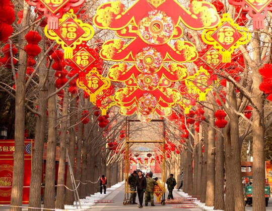 Chinese workers decorate a park for the upcoming Chinese New Year celebrating the Year of the Rat in Beijing on Thursday, January 16, 2020. China will celebrate its Lunar New Year on January 25 as millions of Chinese travel home for the holiday.  PEK2020011625 STEPHENxSHAVER