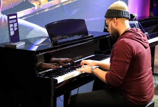 (200117) -- ANAHEIM, Jan. 17, 2020 -- A convention goer experiences a piano at YAMAHA booth during the National Association of Music Merchants (NAMM) Show in Anaheim, the United States, Jan. 16, 2020. The 118-year-old NAMM Show, one of the world s biggest music industry trade shows, kicked off here on Thursday. The four-day event is expected to bring together at least 110,000 people and around 2,000 exhibiting companies from more than 120 countries and regions around the world, featuring more than 7,000 brands, cutting-edge industry education, as well as exclusive special events, concerts and experiences. ) US-ANAHEIM-NAMM SHOW-OPEN LixYing