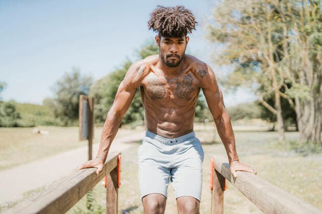 Young man during workout in a park model released Symbolfoto  FBAF01241
