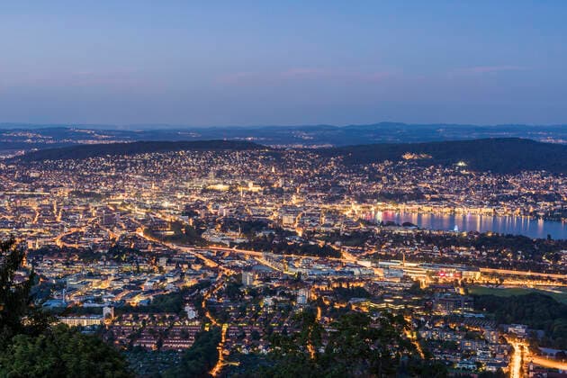 Switzerland, Canton of Zurich, Zurich, City surrounding edge of Lake Zurich seen from Uetliberg at dusk  WDF05648