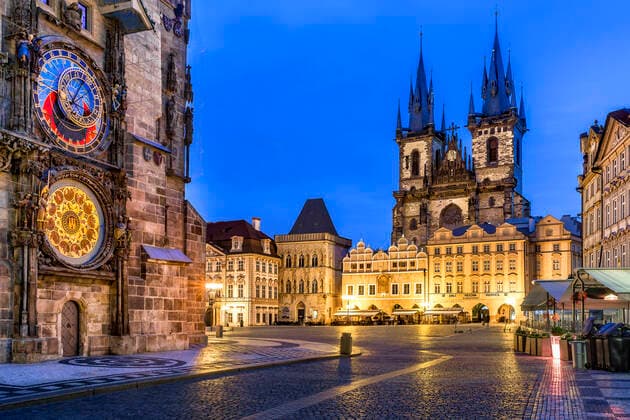 Czech Republic, Prague, Astronomical clock of Old Town Hall and Church of Our Lady before Tyn at dusk  YRF00227