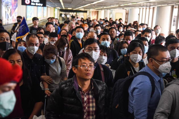 Thailand: Protection for corona virus in Bangkok Passengers wearing mask to avoid the contamination of corona virus. Passengers instruct to use alcohol gel to clean hands. Distribution of public relations documents written in Chinese and English suggesting how to protect self and contact numbers for suspected human being infected with new strain of corona virus at Don Mueang International Airport in Bangkok. Thailand VichanxPoti
