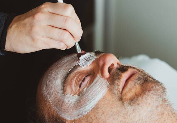 Middle-aged man in a beauty salon with a facial mask *** Middle aged man in a beauty salon with a facial mask  1085307079
