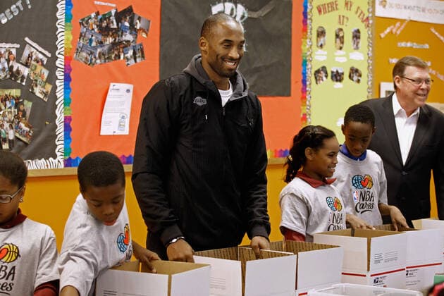 December 13, 2010, Washington, District of Columbia, USA: Los Angeles Lakers guard Kobe Bryant helps children volunteers fill care packages during a NBA Cares service event at the Boys and Girls Club at THEARC, December 13, 2010 in Washington, DC. Bryant and all the members of the 2010 NBA Championship Lakers team volunteered on projects at the club before being honored by the president for their victory. .Credit: - Pool via CNP Washington USA - ZUMAs152 20101213_zaa_s152_011 Copyright: xChipxSomodevillax