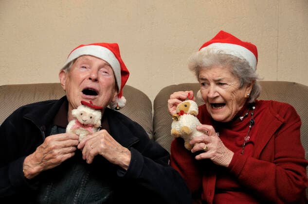 Senior couple celebrating christmas Old senior couple with santa hats celebrating christmas  Copyright: xfahrnerx 1366420