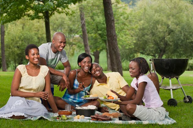 A group of Young African friends picnic together in a park  Copyright: xGreatstockx PE-008-0061G