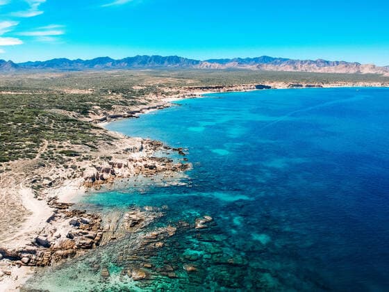 aerial drone view over desert mountains and blue ocean and reef Mexico Cabo San Lucas, B.C.S., Mexico CR_IRTO191216C-260212-01