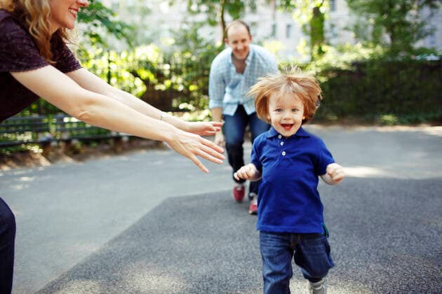 Boy running towards camera as parents playfully chase him New York, NY, United States CR_ISKO191211B-258150-01
