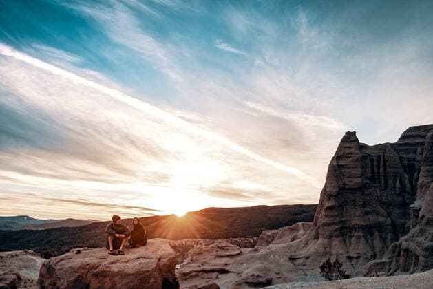 couple enjoying sunrise in Desert Mojave, CA, United States CR_JARA200103B-249033-01