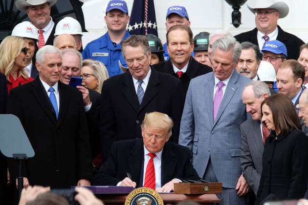 President Donald Trump signs the United States-Mexico-Canada Agreement at the White House on Wednesday, January 29, 2020. On the 2016 campaign trail President Trump made renegotiating the agreement a priority.  WAP202001291007 AlexxWroblewski