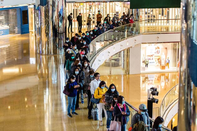 January 31, 2020, Hong Kong, China: People stand in a queue outside a dispensary to purchase masks and hand sanitizers. In light of a coronavirus outbreak in Hong Kong citizens wore face masks in fear of contracting the flu. Due to widespread panic and low supply, citizens queued up to purchase face masks and hand sanitizer. Hong Kong China - ZUMAs197 20200131_zab_s197_008 Copyright: xWilliexSiaux
