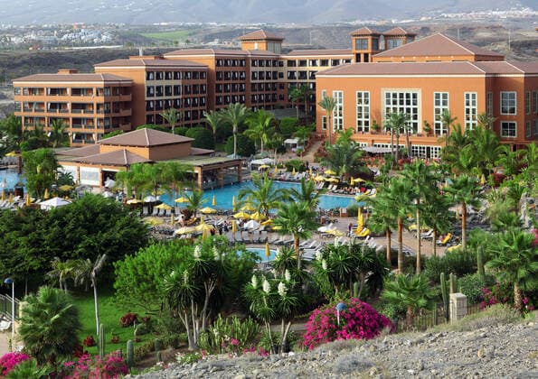 Hotel on Tenerife Big hotel with palms and pool on Costa Adeje, Tenerife  Copyright: xhaak78x 1123614