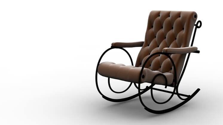 Designklassiker von Ray und Charles Eames Rocking chair A brown rocking chair isolated on white  Copyright: xcla78x 1130656