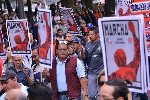 National Struggle Day protest in Mexico MEXICO CITY, MEXICO - JANUARY 31: Demonstrators take part during a march called National Struggle Day to protest for labor equality and demand labor rights and demand a job stability program during the demonstration, integrants of Union of Telephone Operators of the Mexican Republic, National Workers Union, Mexican Union of Electricians, Independent Workers Union of the Autonomous Metropolitan University participating to demand from the Federal Government a change of economic, political and social course for the country; as well as a dialogue around the Alternative Nation Project. at Reforma Avenue on January 31, 2020 in Mexico City, Mexico Copyright: xCarlosxTischlerx EYE_6301