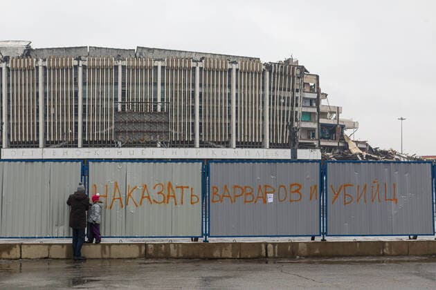 ST PETERSBURG, RUSSIA - FEBRUARY 2, 2020: The message on the fence reads Punish the barbarians and murderers! during a protest against the ongoing dismantling of St Petersburg Sports and Concert Complex (also known as SKK); the protesters demanded that the building be restored and called for an investigation in connection with the death of a worker who died 31 January 2020 in a roof collapse at the site of the sports centre. Roman Pimenov TASS  TS0CCA65