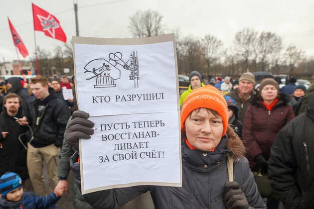 ST PETERSBURG, RUSSIA - FEBRUARY 2, 2020: A demonstrator holds a sign with a message reading Those who destroyed it should restore it at their own expense! during a protest against the ongoing dismantling of St Petersburg Sports and Concert Complex (also known as SKK); the protesters demanded that the building be restored and called for an investigation in connection with the death of a worker who died 31 January 2020 in a roof collapse at the site of the sports centre. Roman Pimenov TASS  TS0CCA69