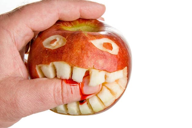 Biting Apple An apple biting the hand that eats it.  Copyright: xrobeox 1404429